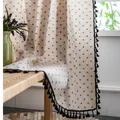 Close-up of linen curtain fabric with floral pattern and black tassel fringe edges - Blue Daisy With Black Tassel Hook Style
