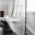 Detalle de cortina blanca semitransparente con borlas negras y bordados de colores - Ancho 140cm x Alto 160cm / Blanco - Parte superior con ganchos