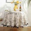 Detail of round floral tablecloth with black tassels and elegant vintage flower print - Black and White Peony With Black Tassel