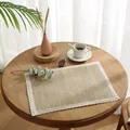 Macro shot of a rectangular jute placemat with delicate white lace edges on a wooden table - 30x40cm / Natural Jute With White Lace