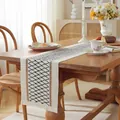 Detailed texture of cotton linen table runner with geometric patterns and tassels - Black Hemp Woven