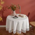 Close-up of white round tablecloth featuring delicate vertical stripe lace fringe detailing - Round 150cm / White (White Meteor Edge)