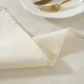 Detailed macro view of cream-white cotton linen tablecloth with neat stitched edges - Small Square Style with Hemmed Edge (5140)