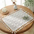 Close-up of white hollow lace placemat with floral embroidery and elegant long tassels - White Clover With Tassels