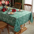 Close-up of dark green Christmas tablecloth with white reindeer and holiday prints - 100cmx140cm / Green Christmas Tree