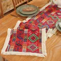 Detailed view of red bohemian table runner with geometric weaving and white fringe - 30x240cm / Jacquard Red Geometric Style