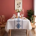 Detailed view of jacquard leaf embroidery and white tassels on a rectangular tablecloth - Blue Cloud Style With Tassel