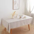 Detail van beige jacquard geblokt tafelkleed met elegante franjes voor huisdecoratie - 140x180cm / Geborduurd Koffie Grid
