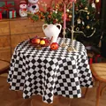 Close-up of black and white checkered round tablecloth with high-quality thick fabric texture - Small Round / Black White Gingham
