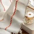 Macro shot of white linen curtain featuring orange geometric embroidery and tassel details - Orange Single-sided Curtain With Suzhou-style Hooks (reverse Pressure) / 132cm Wide * 45cm Long