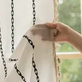 Detailed texture of beige striped curtain with black geometric patterns and fringe - Black Single-breasted Curtain With Suede Hooks (reverse Pressure) / 132cm Wide * 45cm Long