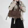 Deep brown oversized retro tote bag with fringe details and metallic buckle accents - Coffee