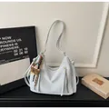 Detail of white PU leather hobo bag featuring dual decorative zippers and a brown bear charm - Single Bag / Blue