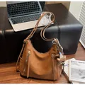 Brown soft leather shoulder bag with vertical zipper details and cute bear pendant - Single Bag / Brown