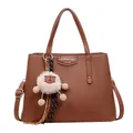 Brown litchi texture PU leather square crossbody bag with a white plush pompom charm - Brown