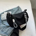 Fashionable black crescent shoulder bag with white FASHION lettering on adjustable strap - Black