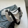 White canvas crescent moon crossbody bag with black 'FASHION' strap and large capacity - White and Black