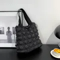 Minimalist black quilted puffer tote bag with diamond stitching and shoulder strap - Black