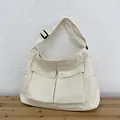 Cremefarbene Canvas-Umhängetasche mit großen Cargotaschen und verstellbarer Schnalle - Weiß