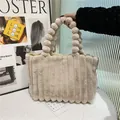 Beige plush tote bag with vertical striped faux fur and spherical pom pom handles - Khaki