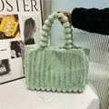 Light green plush tote bag with vertical stripes and fuzzy ball handle decoration - Green