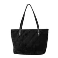 Black velvet tote bag featuring quilted diamond pattern and golden rivet handle details - Black