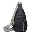 Black lychee leather crossbody bag with geometric woven strap and gold hardware accents - Black