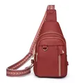 Burgundy lychee pattern leather chest bag with ethnic style colorful woven wide strap - Red