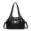 Sac à main noir matelassé pour femme avec doubles lanières et fini brillant - Noir