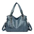 Vintage dark blue leather tote bag with decorative tassels and adjustable shoulder strap - Light Blue