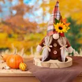 Fall gnome doll with red plaid hat, white braids and yellow sunflower detail - Braid Style