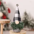 Detail of Christmas gnome figurine with buffalo check hat and green pine needle beard - Black and White Plaid Tree Gnome