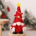 Close-up of Christmas gnome with star hat, soft felt texture and white plush braids - Red Santa Tree