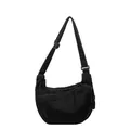 Large black denim crescent crossbody bag with white contrast stitching and adjustable strap - Black