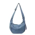 Light blue denim crescent crossbody bag with woven zipper pulls and adjustable strap - Light Blue