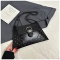 Detail of black oiled leather bag with silver buckle and vintage metal studs - Black