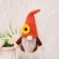 Autumn gnome plush pendant with orange knitted hat and yellow sunflower detail - Brown Style Gnome Pendant (Model A)