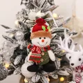 Plush Christmas snowman pendant featuring a red hat, knit scarf, and green vest ornament - Snowman Style