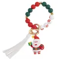 Weihnachts-Schlüsselanhänger aus Silikonperlen mit Nikolaus, weißer Quaste und Goldring - Weihnachtsmann-Anhänger