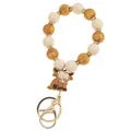 Detail of beaded keychain bracelet with golden marble beads and cartoon highland cow charm - White Yellow Yak Charm Keychain Bracelet