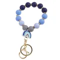 Close-up of rainbow bead keychain with blue and purple silicone beads and gold metal clasp - Blue Teal White Rainbow Keychain Bracelet