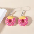 Sweet pink doughnut food-shaped earrings with colorful sprinkles on a soft beige background - Donut / Pink