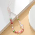 Detail of pink tulip beaded phone charm with pearls and bow-shaped pendants - Crystal Butterfly Heart Style