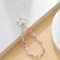 Detail of handmade beaded phone strap with pink tulip, resin bow and faux pearls - Butterfly Bear Heart Style