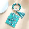 Dettaglio portafoglio verde con pupazzo di neve e bracciale di perline in silicone - Pupazzo di Neve Verde Scuro