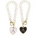 Pair of heart-shaped letter A pendants with white and black enamel on gold chains - Black and White-Letter A