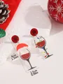Christmas wine glass earrings with Santa hat and lights on a festive stone background - Christmas Wine Glass Style