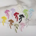 Vista detallada de colgantes de lazo en once colores para la creación de joyería - Lazo de Aleación 3D Pintado