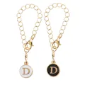 Pendentifs lettre D en émail noir et blanc avec chaînes dorées et fermoirs mousqueton - Lettre D Noir et Blanc