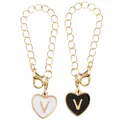 Golden heart-shaped 'V' letter charm pendant with black and white enamel finish - Black and White-Letter V